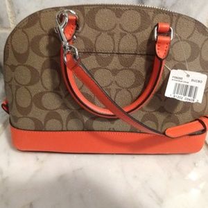 Brand New Coach purse with orange trim